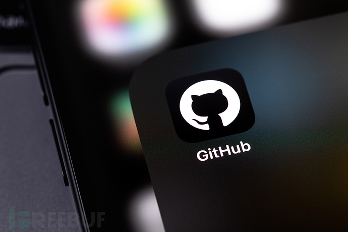 GitHub移动端应用图标与笔记本电脑特写
